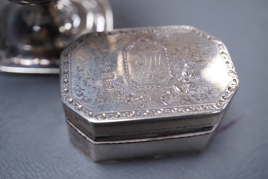 A George III silver octagonal nutmeg grater by Phipps & Robinson, London, 1810, 46mm(a.f.), together with a George III silver pedestal pepperette, by Alice & George Burroughs, London, 1808, 70mm.